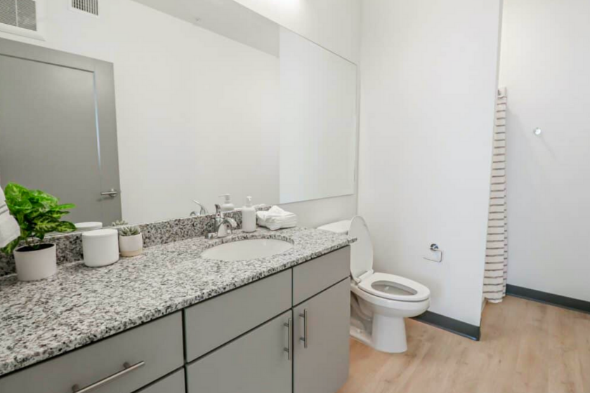 Spacious bathroom with a shower in one of the student dorms at The Green on Campus Drive at UVU.